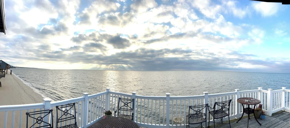 deck,  a vast panoramic view, cloudy day 