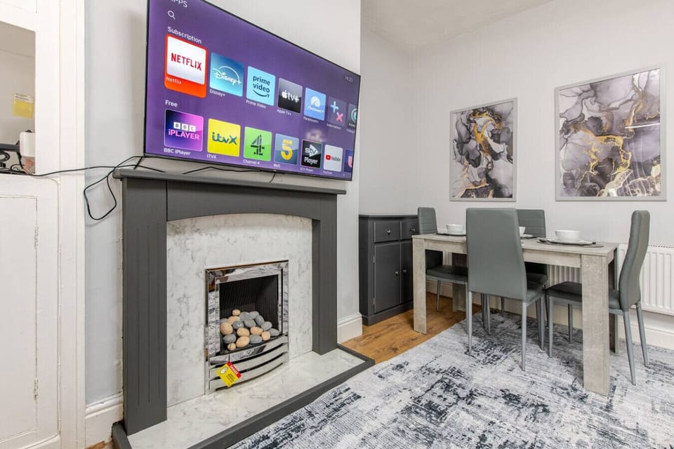 Settle in for an evening with the TV and fireplace next to the dining space.Settle in for an evening with the TV and fireplace next to the dining space.