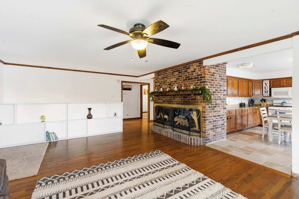 Open, inviting living room with ample seating and smart TV