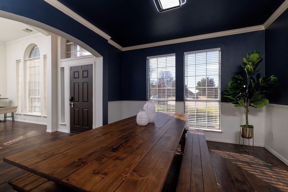Rustic-chic dining room with a large farmhouse table.
