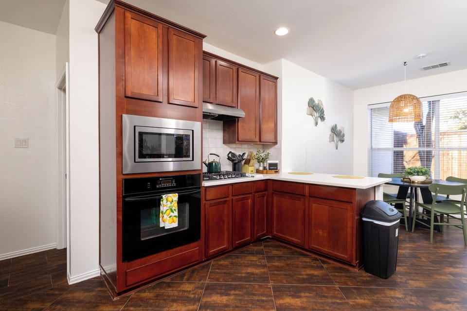 Functional kitchen space with an undermount sink and bar seating.
