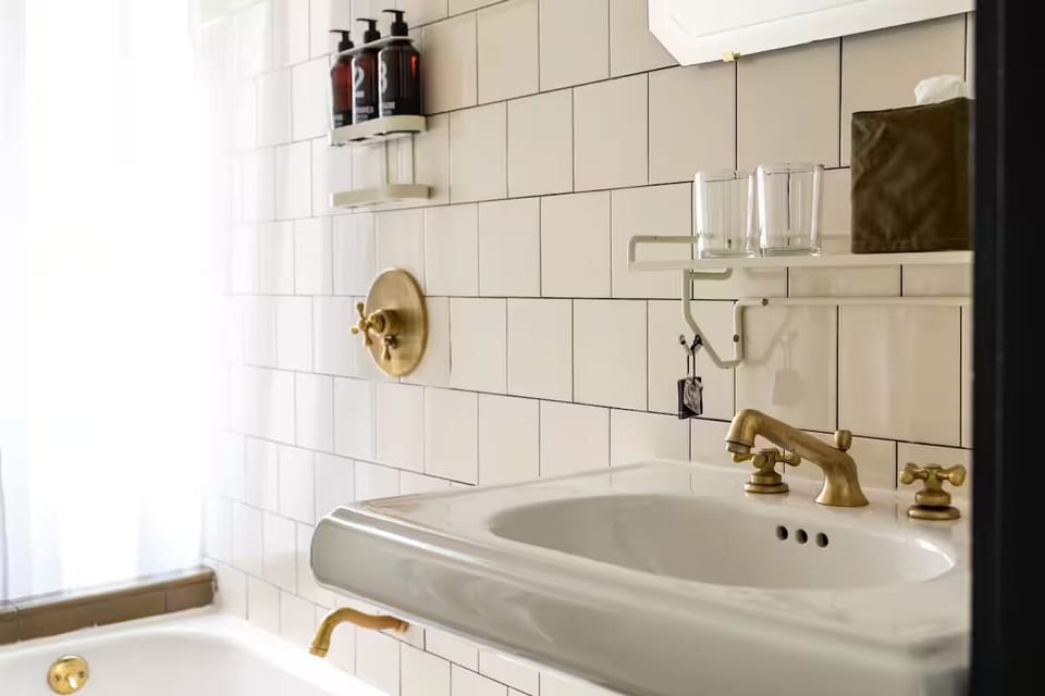 Refresh after adventures in a bright, spa-like tiled bath.