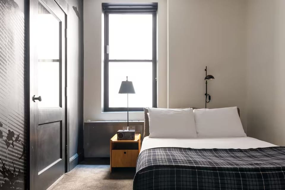 Wake up refreshed beside bright windows and crisp linens.