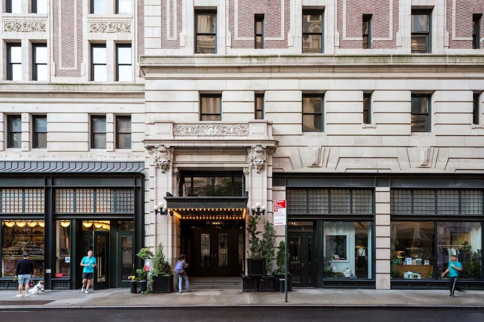Arrive in style beneath a classic marquee and city buzz.