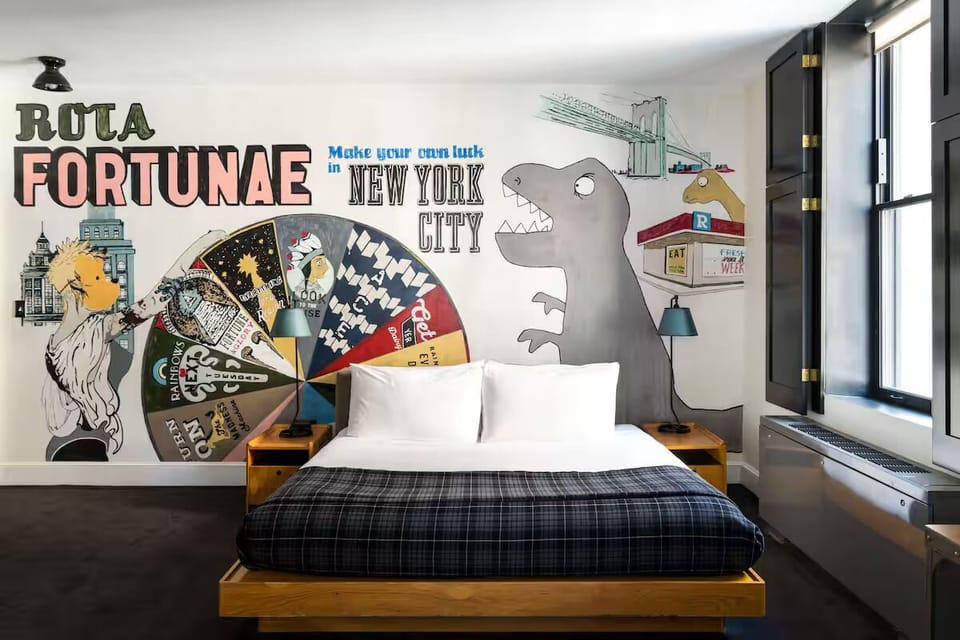 Escape into a statement-suite with playful mural and comfy bed.