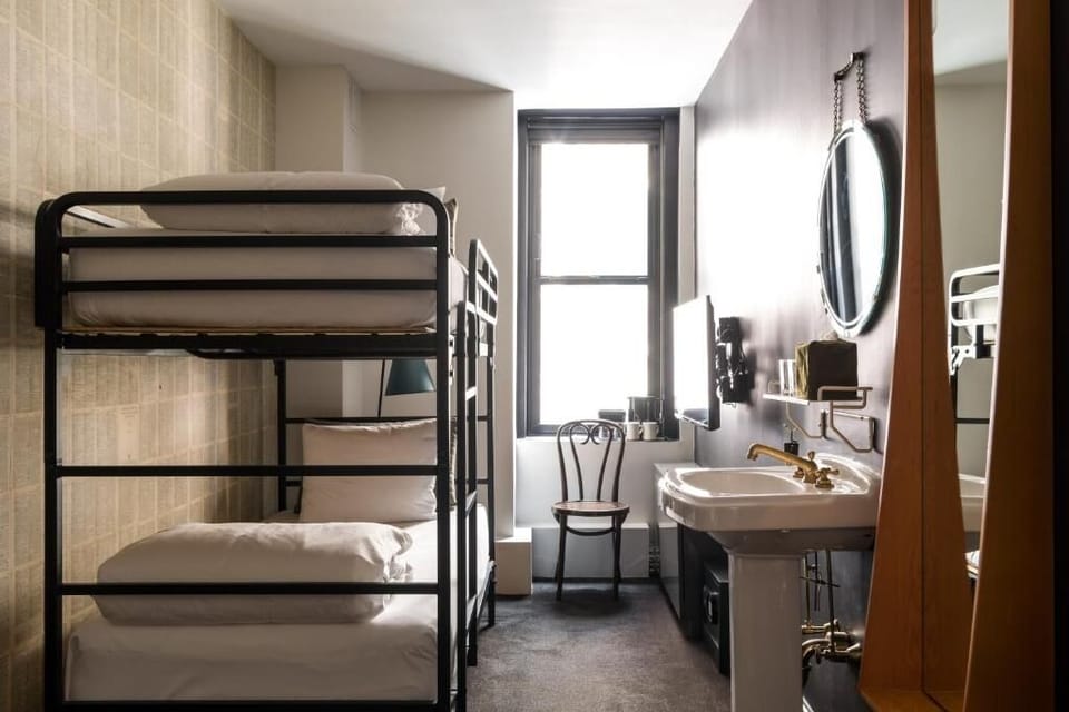 Settle into crisp bunks in a bright, cozy room.