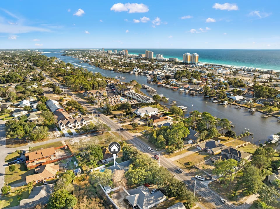 Coastal retreat near beach and canal—walk to water, dining, and fun.