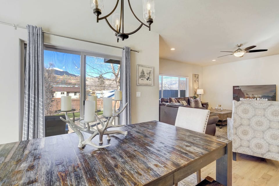 Large sliding glass doors in the dining area provide easy access to the private backyard and patio. This bright space allows you to enjoy the fresh mountain air while staying connected to the main level.
