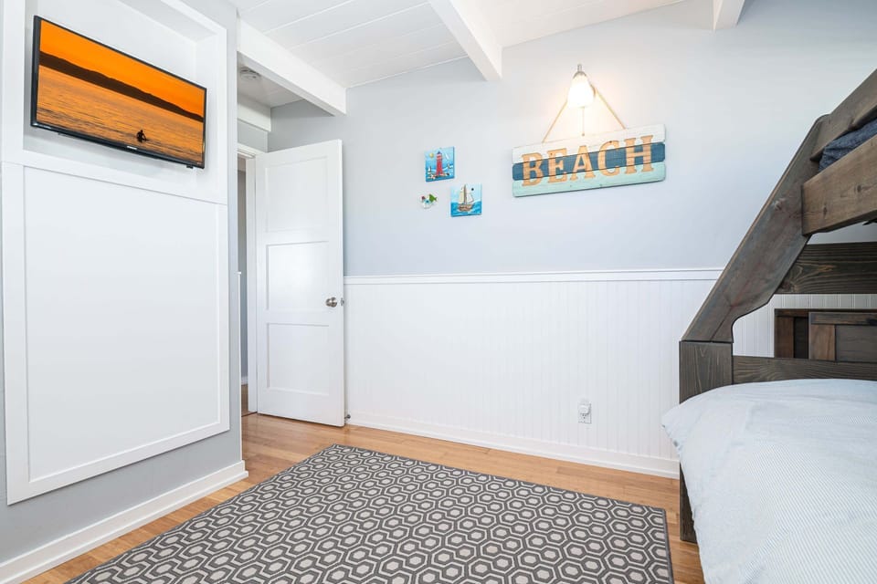 Ideal for kids and extra guests, this room also includes a flat-screen TV for cozy movie nights and downtime
                