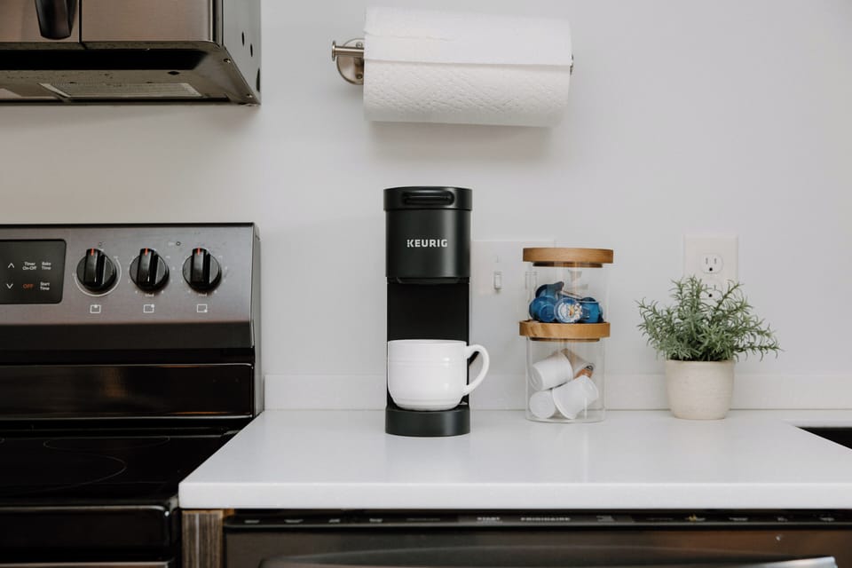 Start your day with the Keurig coffee station, complete with a starter supply of pods and creamers for added convenience.