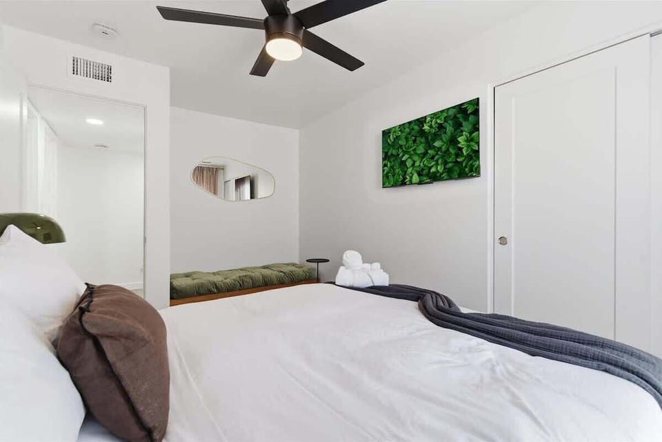 3rd Bedroom featuring a Queen bed, smart TV, cozy furnishings, and a closet.