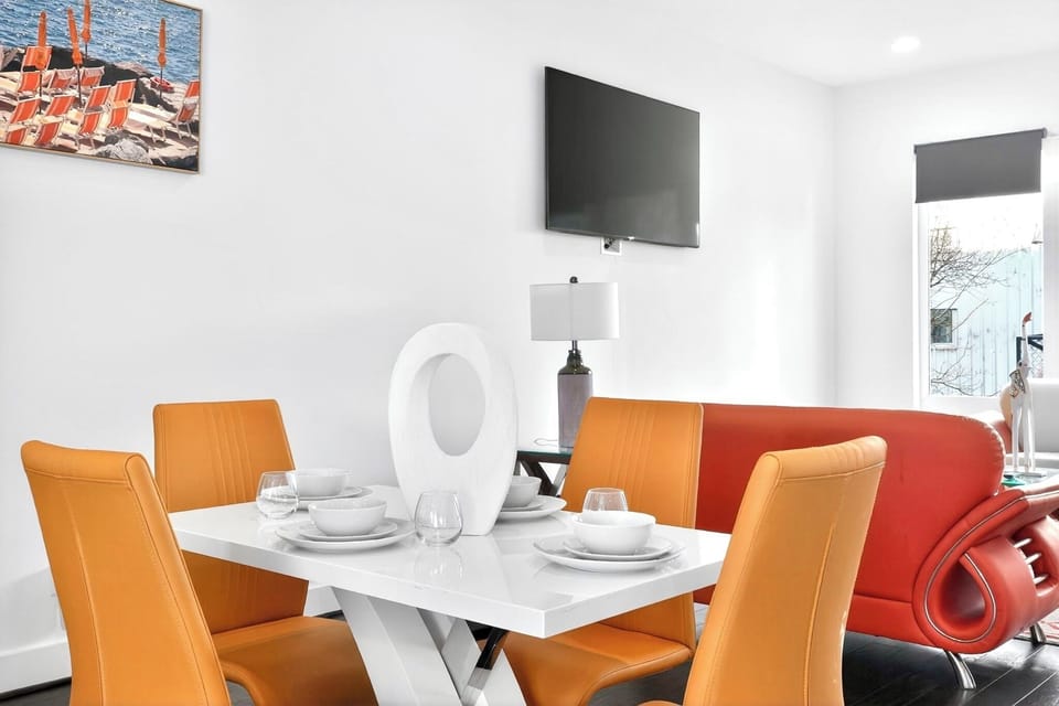 Bright modern dining area with stylish seating and open living space