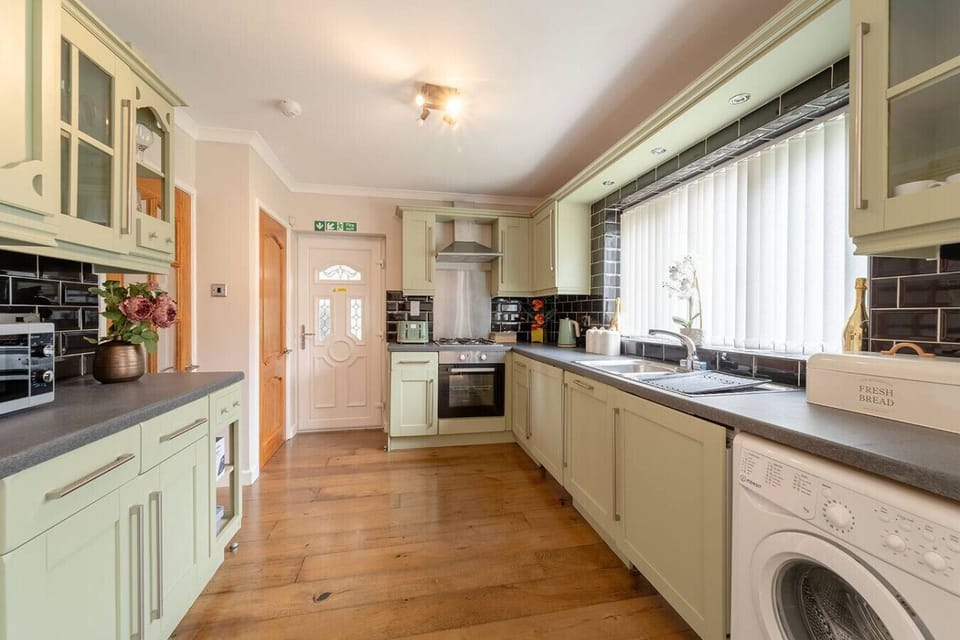Prepare meals in the long galley kitchen with extensive counters and cabinetry