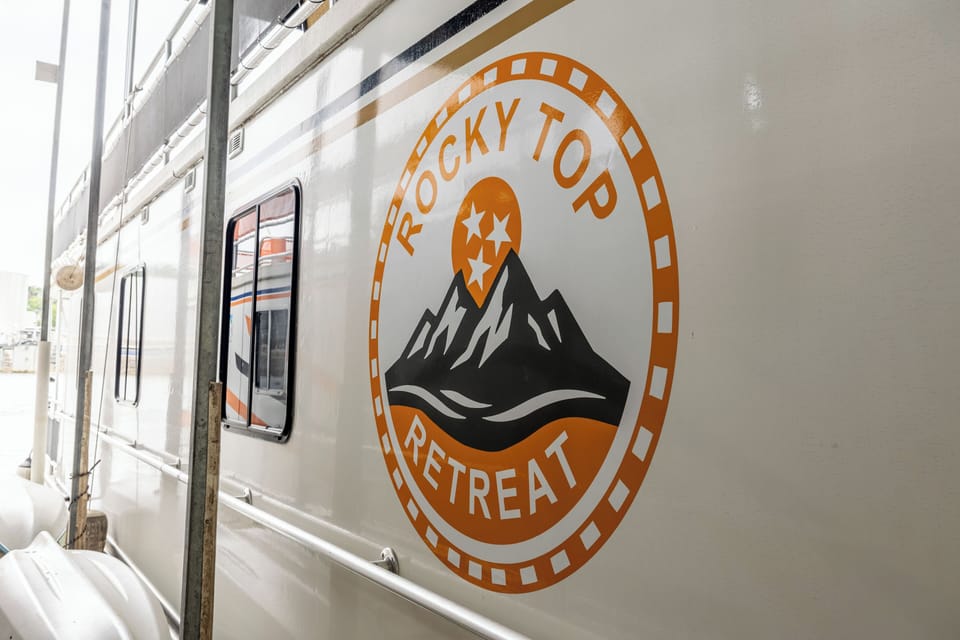 Find the Rocky Top Retreat medallion on the hull, designed by the owner!