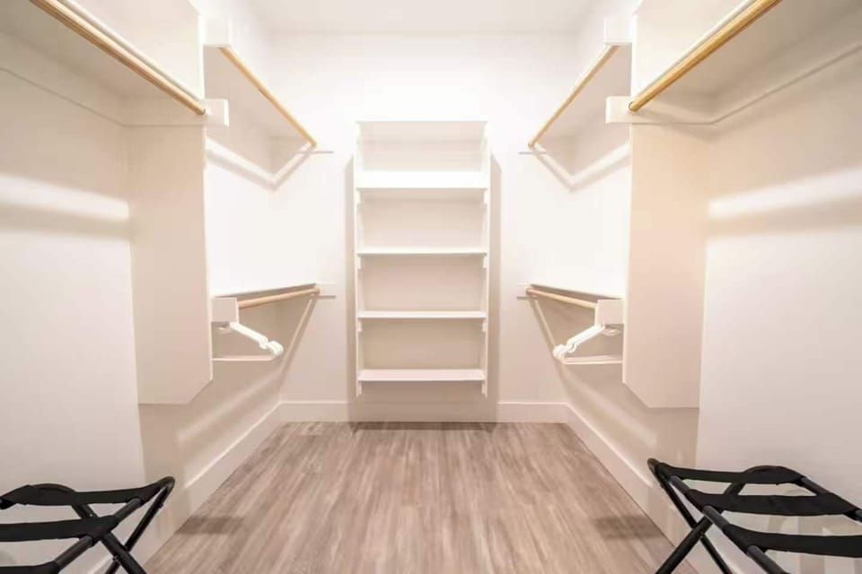 This walk-in closet exemplifies the beauty of a well-designed space.