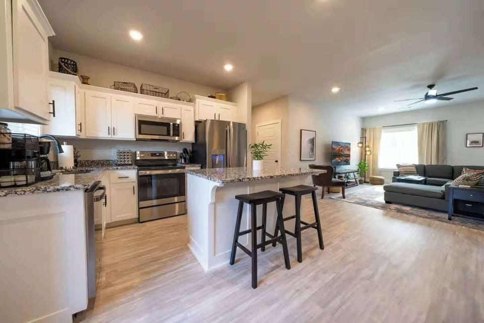 Embrace the beauty of modern living. This kitchen, with its sleek design and open layout, is not just a space for cooking; it's a heart that welcomes gatherings and memories.