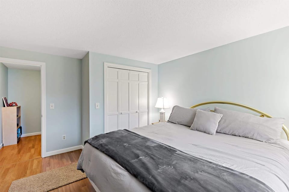 Additional view of the lower-level king bedroom, showing comfort and coastal charm.