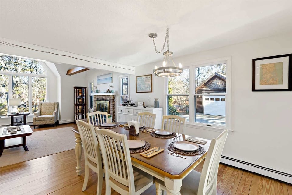 Dining area with natural light and outdoor views, perfect for relaxed meals in this Eastham summer rental.