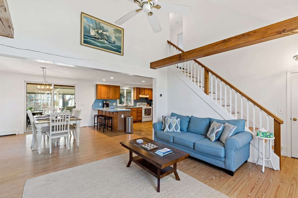 Open-concept living, dining, and kitchen, designed for groups, games, and shared meals on Cape Cod.
