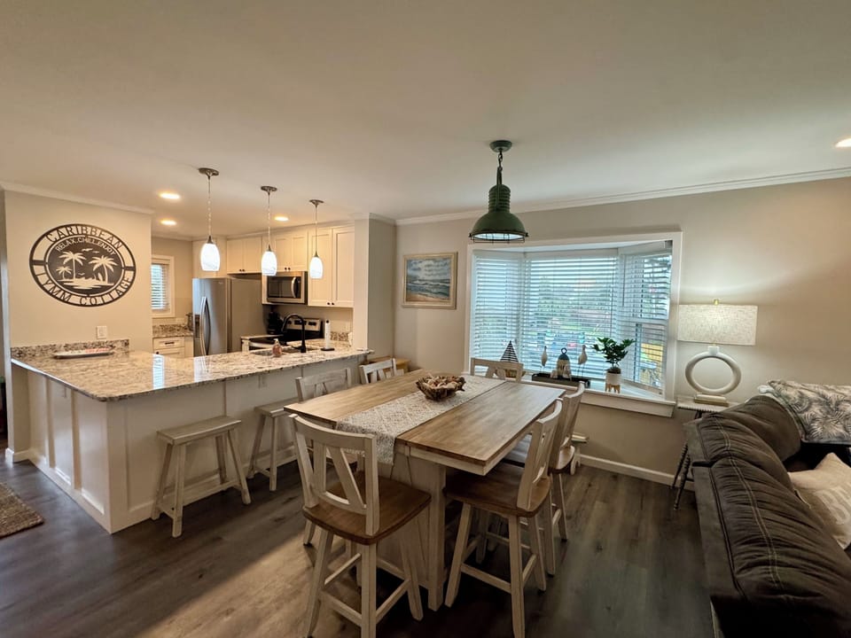 Dining area has seats for 6 plus 3 bar stools