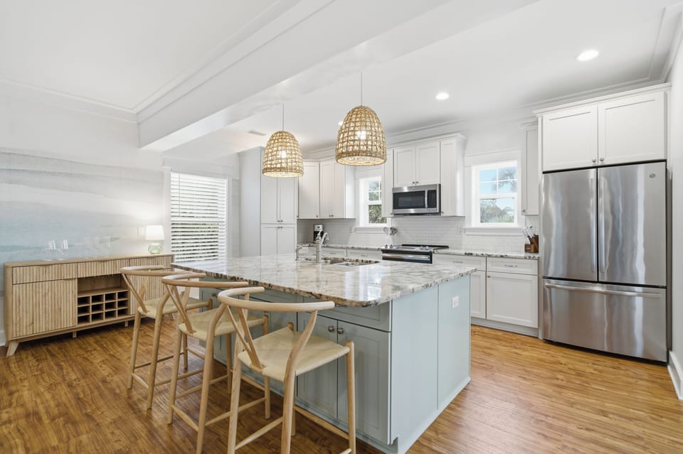 Kitchen and dining area with stainless appliances and ample seating