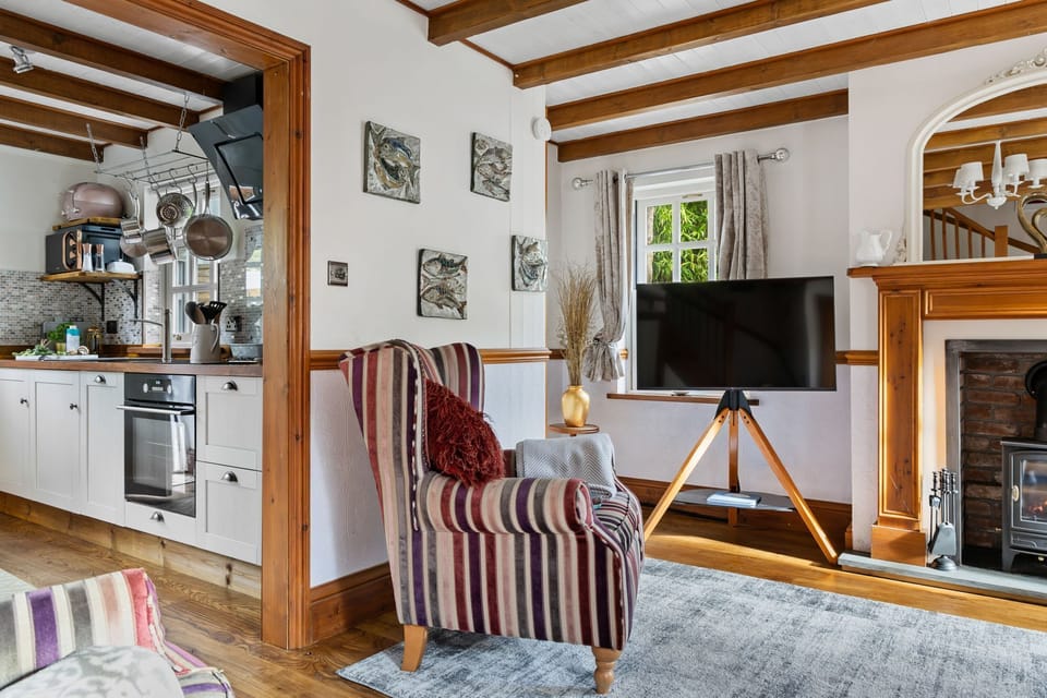 Living room with kitchen beside - Beryas Cottage