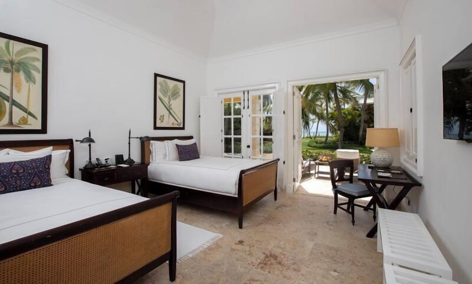 Settle into crisp twin beds with garden-to-ocean scenery