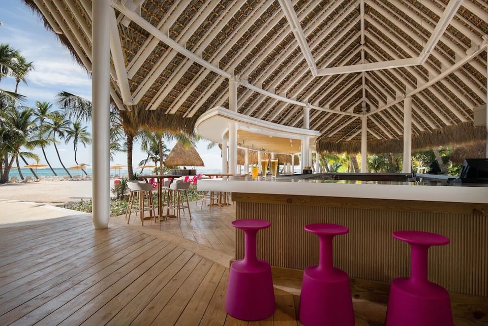 Sip sunset cocktails at the breezy open-air beach bar.