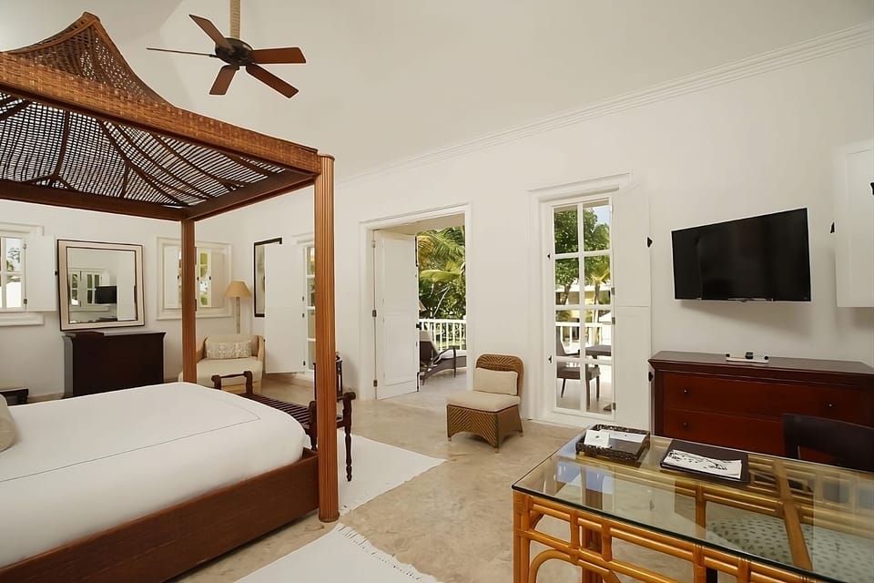 Relax beneath the romantic canopy bed in a breezy retreat