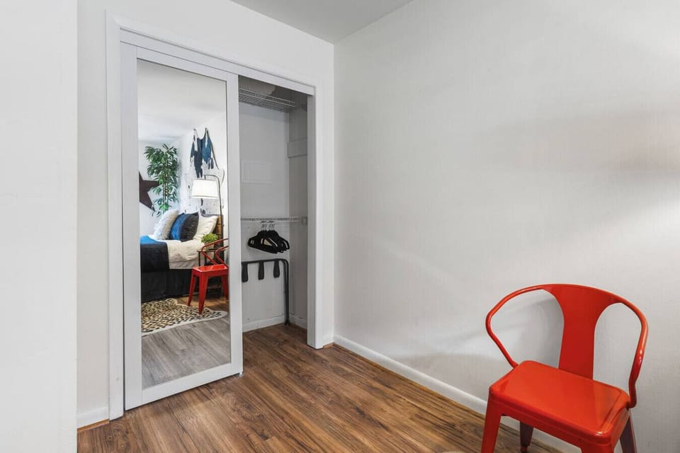 Comfortable King bed in the bedroom. Includes a smart TV, desk to get ready at, dresser and a closet to store your items in.