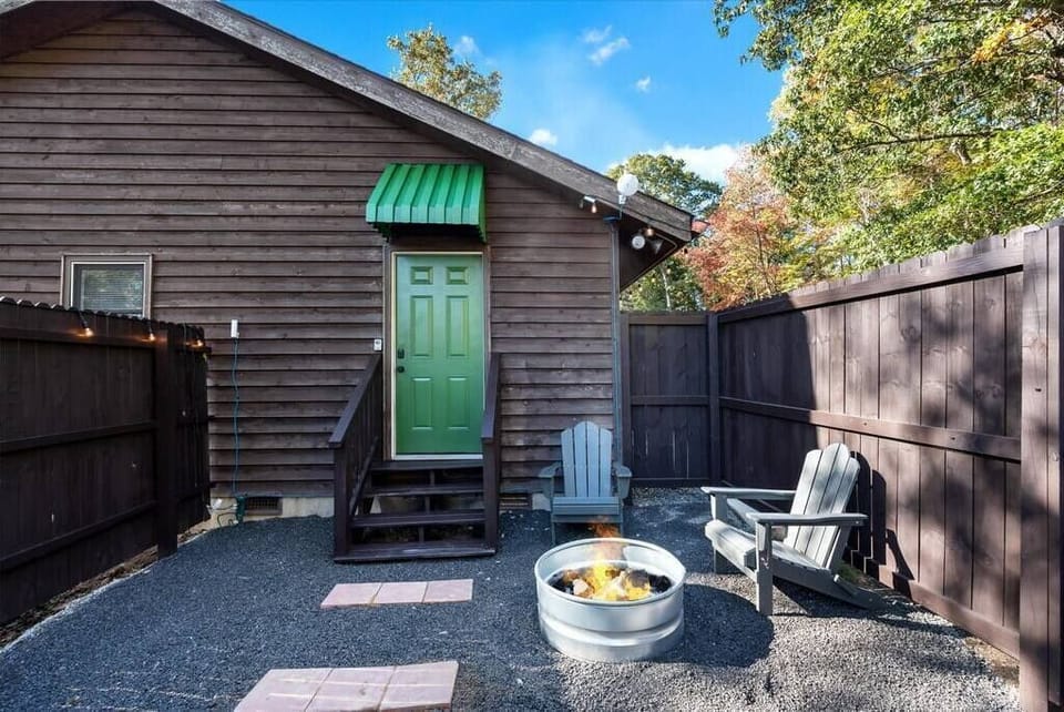 Green Door Suite on the farm! This patio area includes a fire pit, propane grill and hot tub - all for your use during your stay