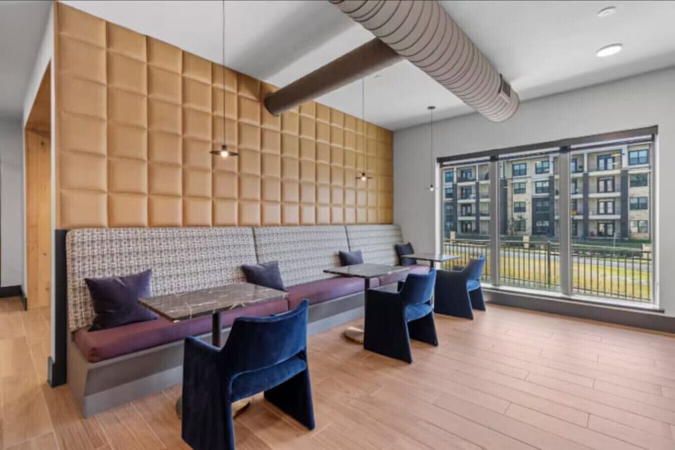 Entertainment Ready: Massive TV and comfortable lounge seating.