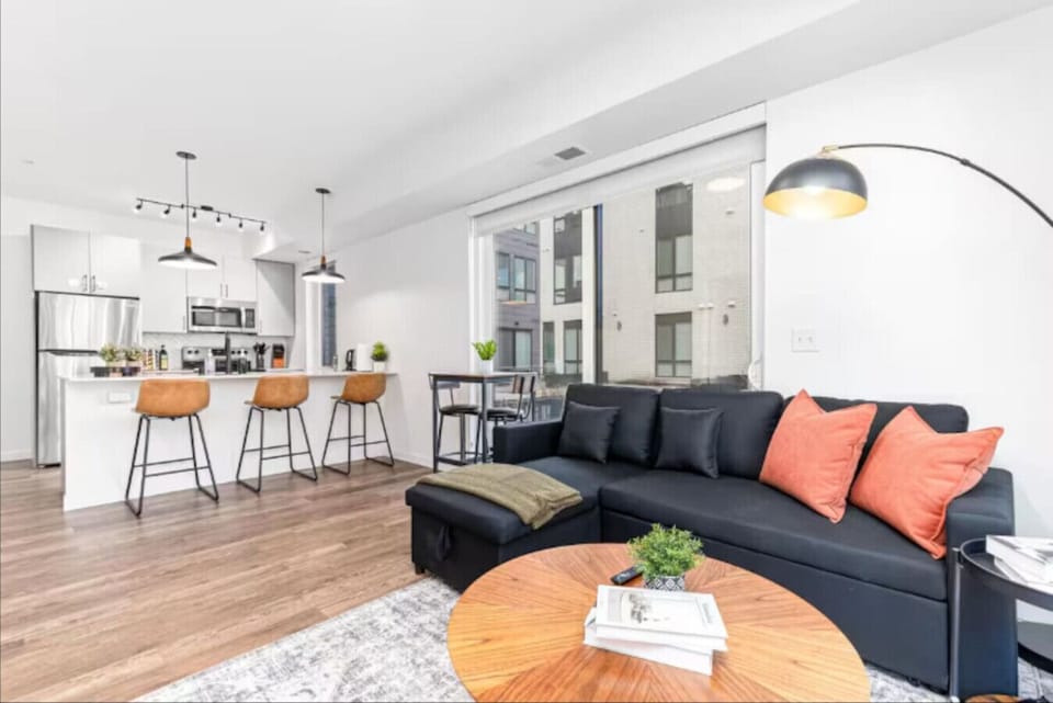 Relax on the plush sofa and soak in the natural light from our floor-to-ceiling windows. Whether you’re catching up on your favorite show or enjoying a morning coffee at the bistro set, this modern space is designed for ultimate comfort and city views.