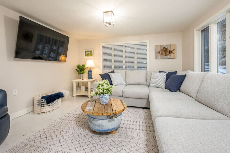 The perfect place to gather. This spacious living room offers a large sectional, cozy swivel chairs, and a 75” Roku TV - ideal for movie nights, game-day viewing, or relaxing together after a day out.