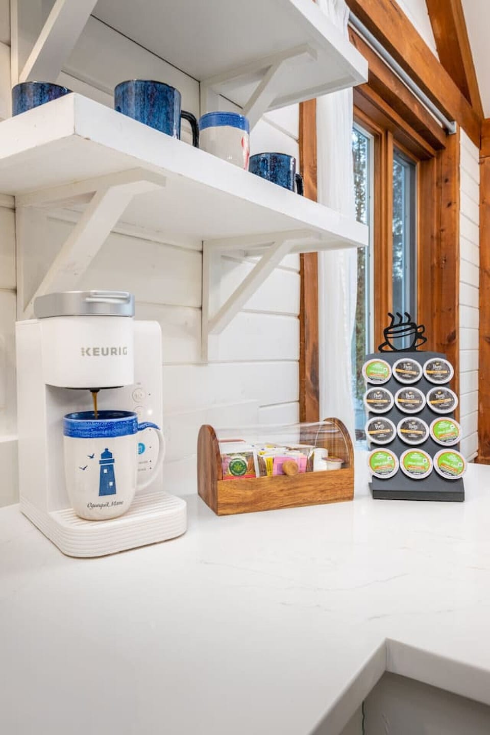 Coffee is always on us ☕ A dedicated coffee bar with Keurig, pods, mugs, and extras, because hospitality and the little details matter here.