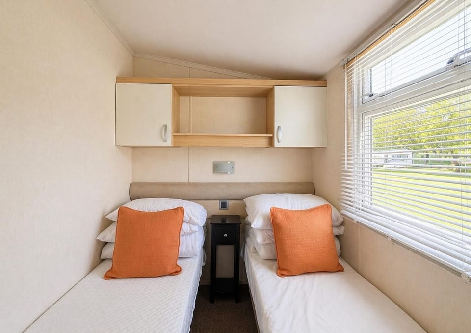 The twin room in this modern caravan is perfect for the kids. They will love unpacking and making the space their own. You will also get a great nights sleep knowing they are tucked up safe next door.