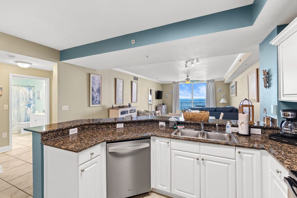 Inviting kitchen view of turquoise Gulf waters and open coastal living space