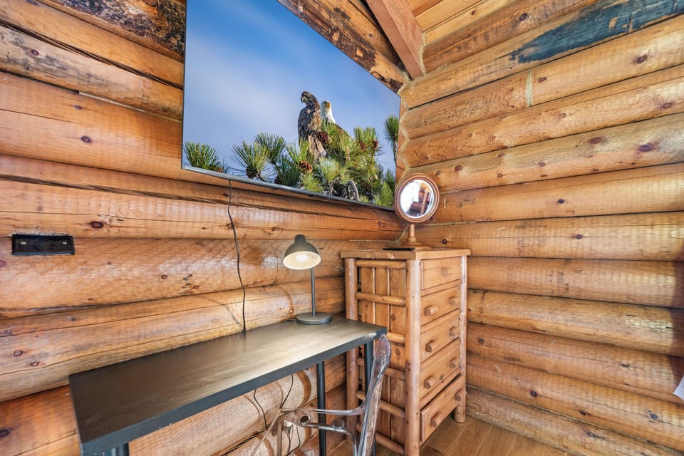 Workspace and 55 inch smart Tv in primary bedroom upstairs