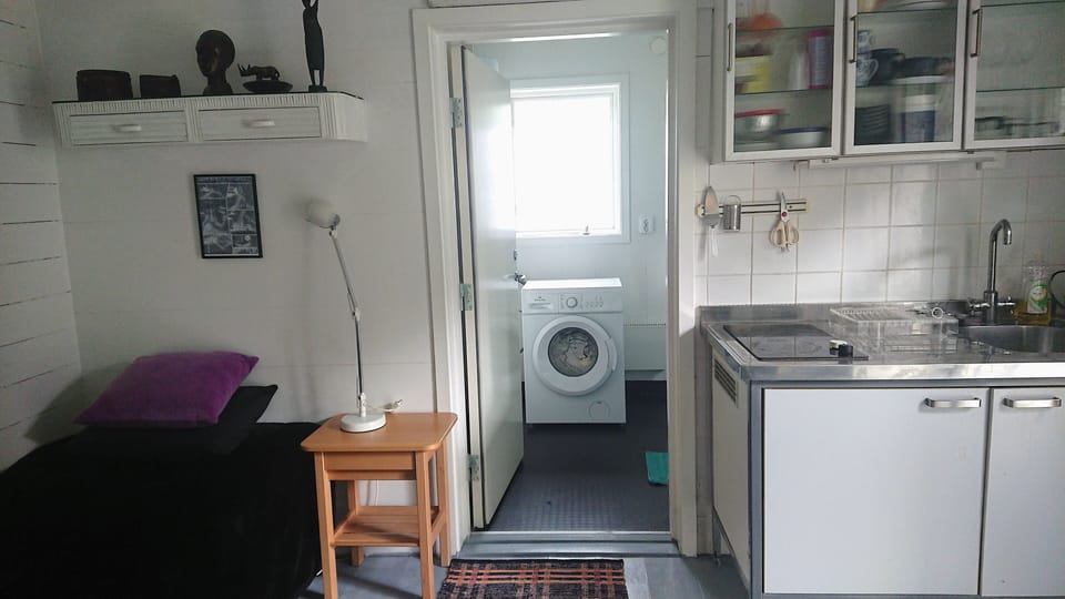 1 single bed/of 2/ kitchen area with plates,cups...view  washing machine . 