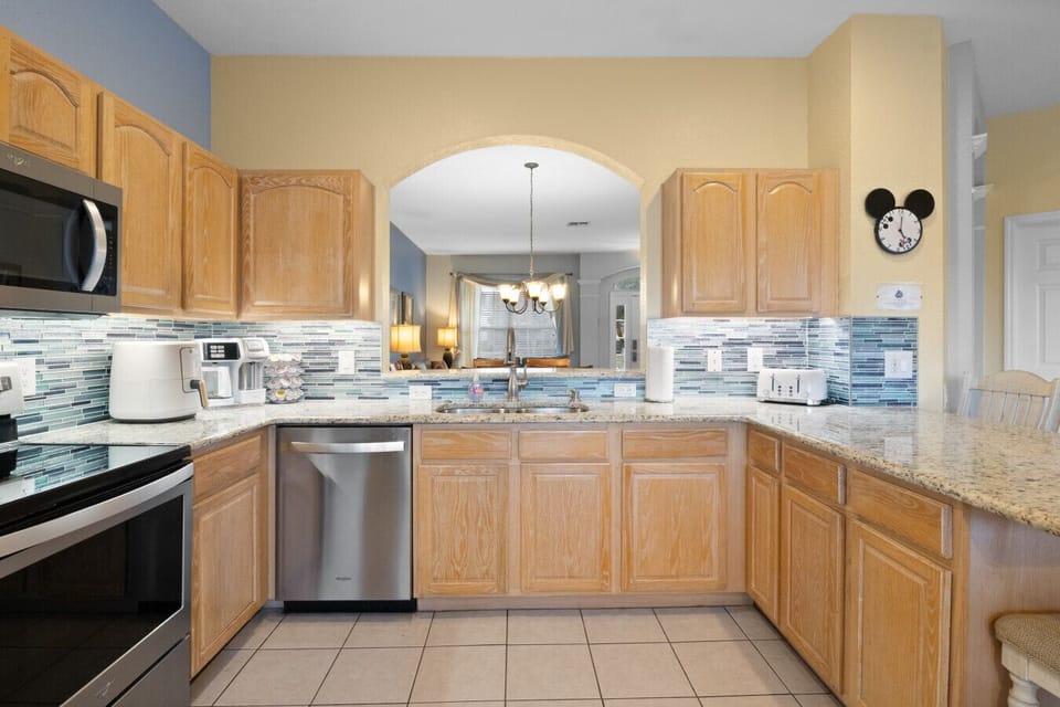 Spacious kitchen with stainless appliances and ample counter space