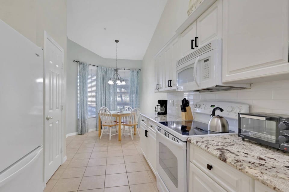 The kitchen is well equipped with an oven, dishwasher, refrigerator/freezer, microwave, toaster oven and pantry cupboard.