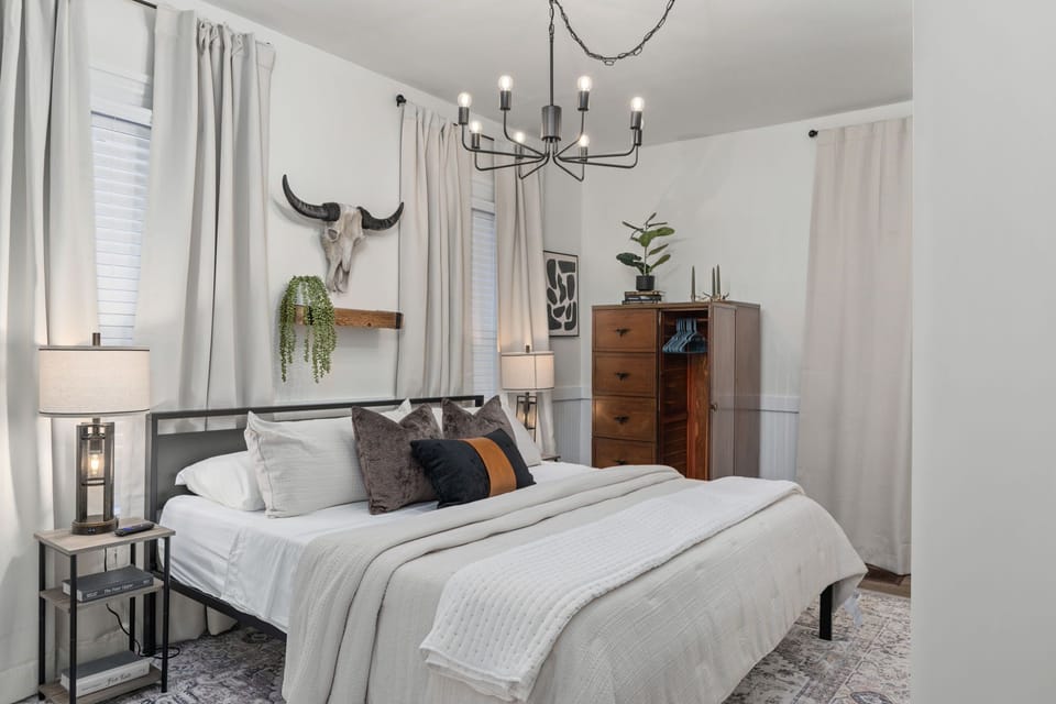 Primary Suite: King bed with private bathroom (walk-in shower).