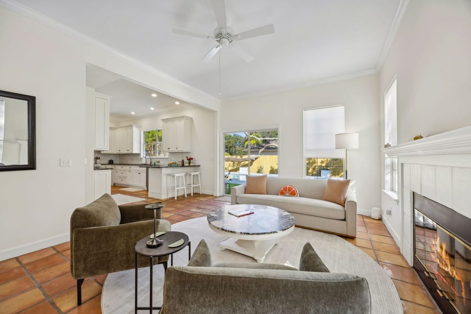 Includes a modern sofa for three people, Coffee table, Accent chairs, Sliding door to access the backyard.