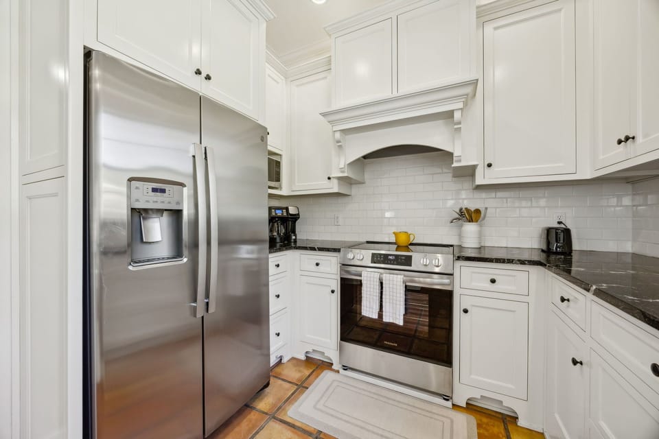 Kitchen is fully stocked for our guests; Refrigerator, Electric range, Microwave, Dishwasher, Standard drip & Keurig dual coffee machine, Toaster, Hot water pot, French press, and more.