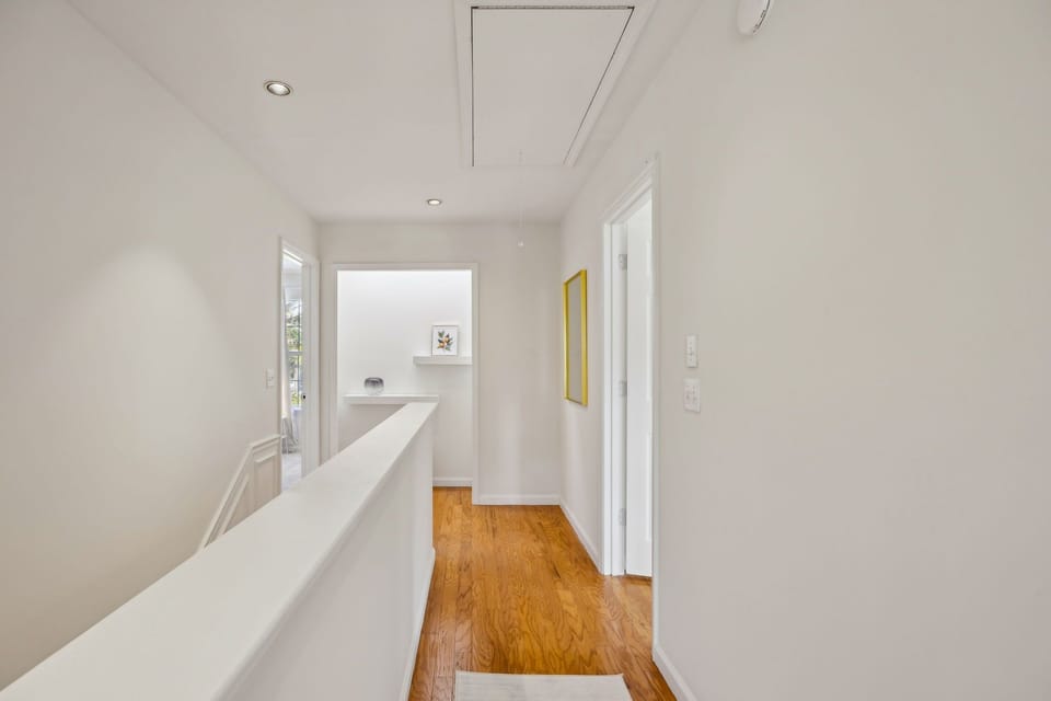 Here is the hallway that connects all three bedrooms on the 2nd floor. We have the Master Bedroom on the right and the Guest Bedroom with the queen bed on the left.