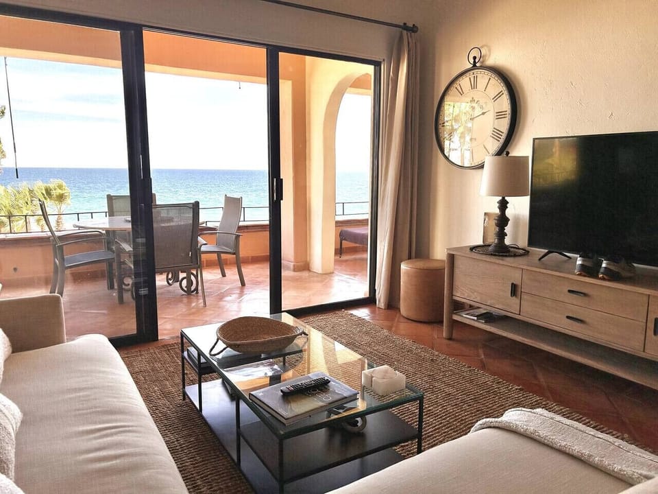 Relaxing lounge with a large sectional and stylish coastal vibes.