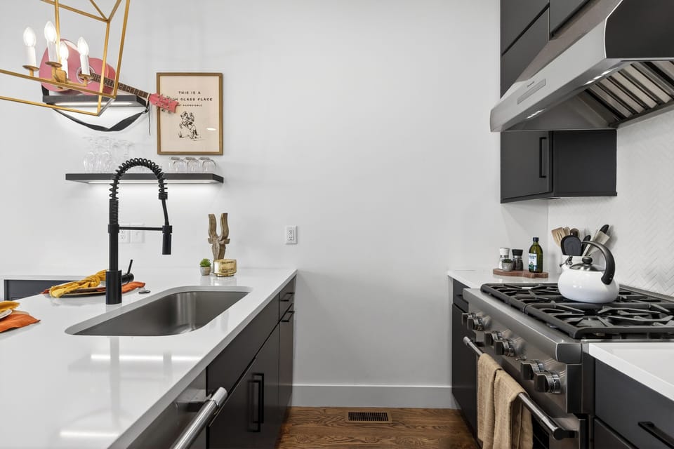 Fully equipped kitchen anchored by a spacious island.