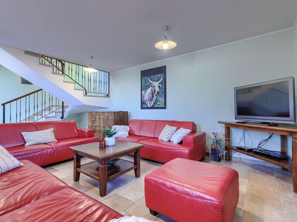 Furniture, Interior Design, Flooring, Couch, Floor, Ceiling, Room, Wood, Television, Living Room