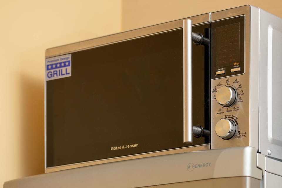 Microwave and kitchen essentials ready for your stay.