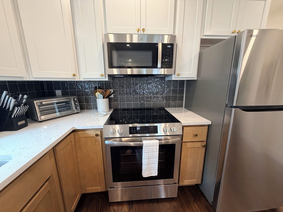 Kitchen range and full-size refrigerator